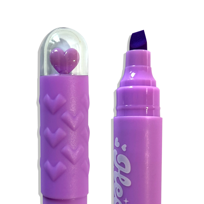 Close up of purple chisel tip and heart topper from OOLY Heart Pops Neon Highlighters on a white background