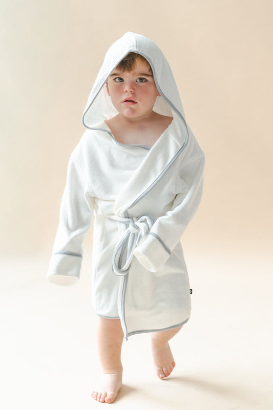 Young boy modeling the Hooded Bath Robe in Cloud with Storm Trim with the hood up