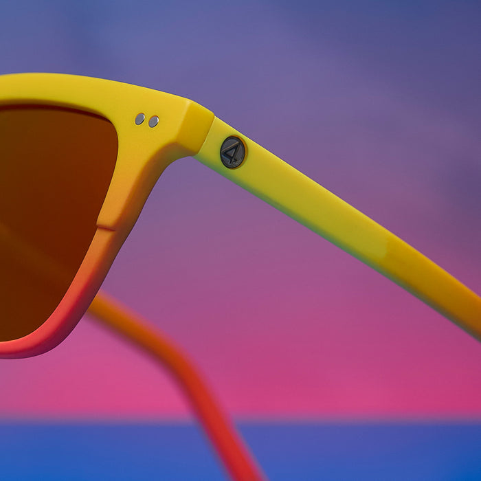 lifestyle - marvel fantastic four x diff eyewear featuring the human torch square sunglasses with a radiant yellow to orange frame fade and blazing red orange mirror polarized lenses detailed view of temple