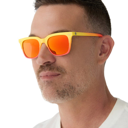 on model - male wearing on model - female wearing diff eyewear x fantastic four featuring the human torch square sunglasses with a radiant yellow to orange frame fade and blazing red orange mirror polarized lenses angled view