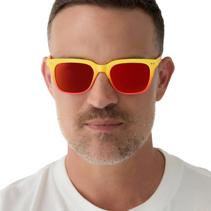 on model - male wearing on model - female wearing diff eyewear x fantastic four featuring the human torch square sunglasses with a radiant yellow to orange frame fade and blazing red orange mirror polarized lenses front view