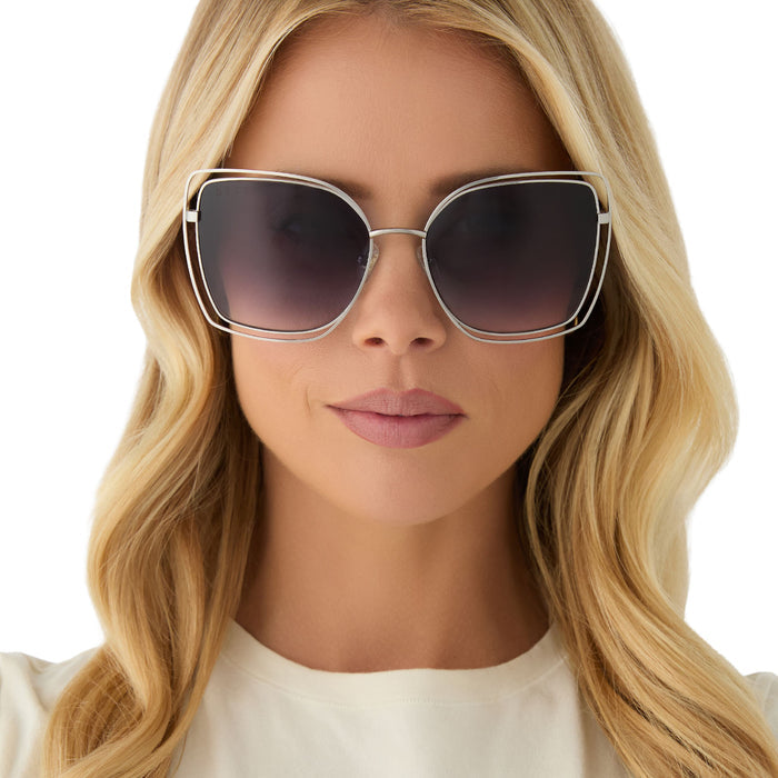 on model - female wearing diff eyewear featuring the jacqueline square sunglasses with a silver frame and grey gradient lenses front view