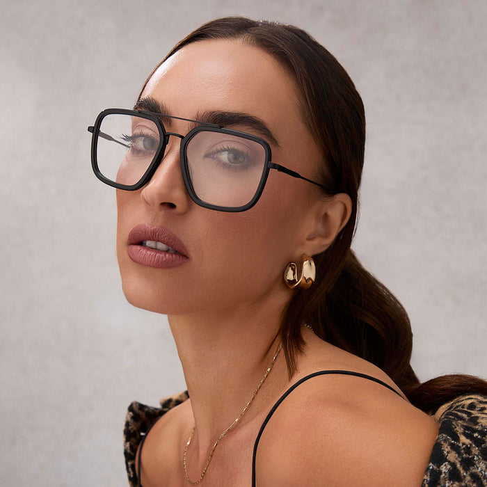 on model - female wearing diff eyewear featuring the jordan navigator glasses with a matte black frame angled view