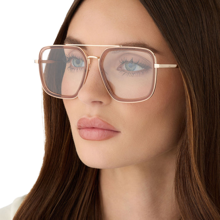 on model - female wearing diff eyewear featuring the jordan navigator glasses with a brown café ole frame angled view