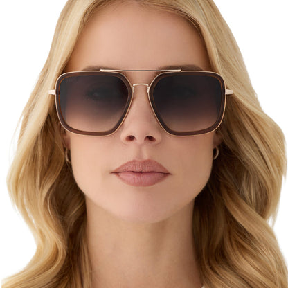 on model - female wearing diff eyewear featuring the jordan navigator sunglasses with a whiskey with gold frame and grey gradient lenses front view