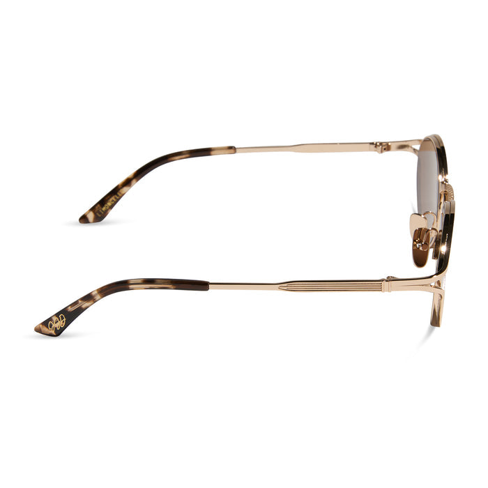 jessie james decker x diff eyewear featuring the limoncello oval sunglasses with a gold frame and brown lenses side view