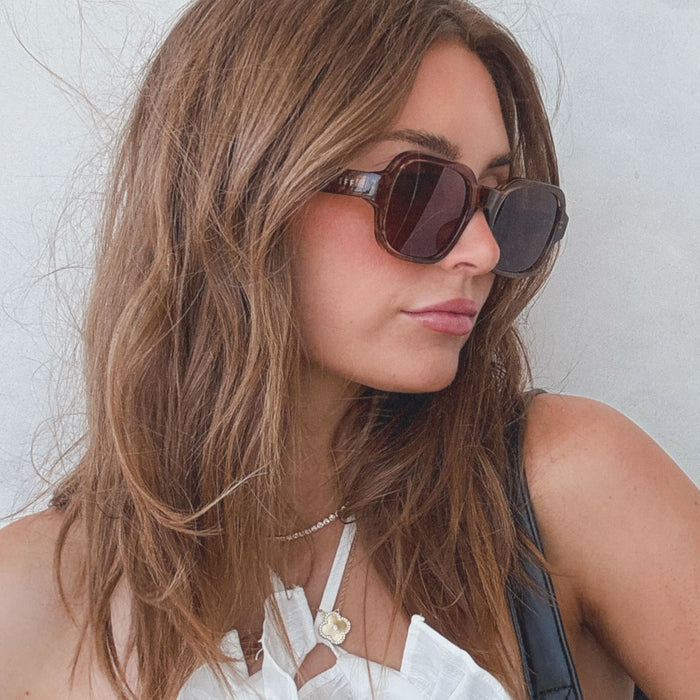 on model - female wearing aspyn ovard x diff eyewear featuring the lola square prescription glasses with a tortoise frame side view