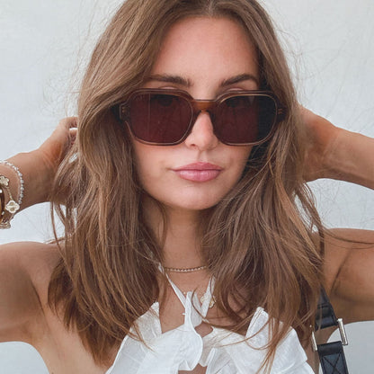 on model - female wearing aspyn ovard x diff eyewear featuring the lola square prescription glasses with a tortoise frame angled view