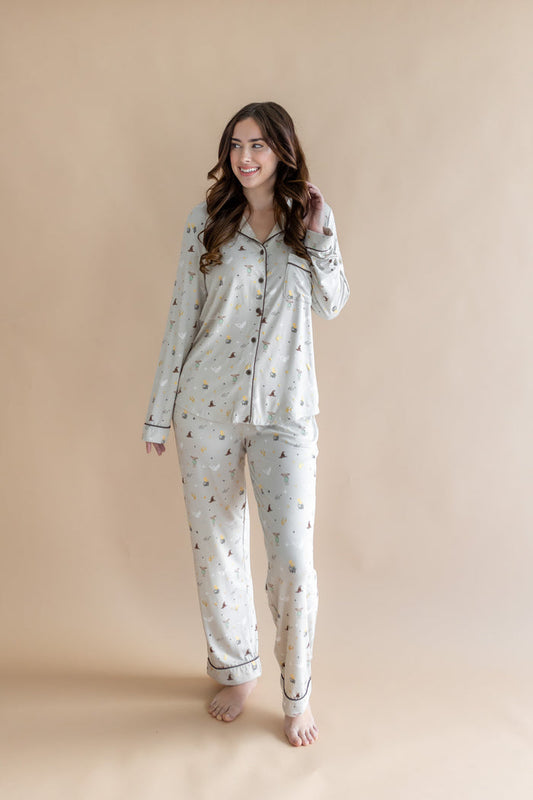 Model wearing a cream Long-Sleeved Women's Pajama Set with Harry Potter prints on a beige background