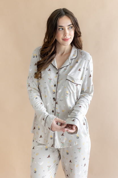 Model wearing a cream Long-Sleeved Women's Pajama Set with Harry Potter prints on a beige background
