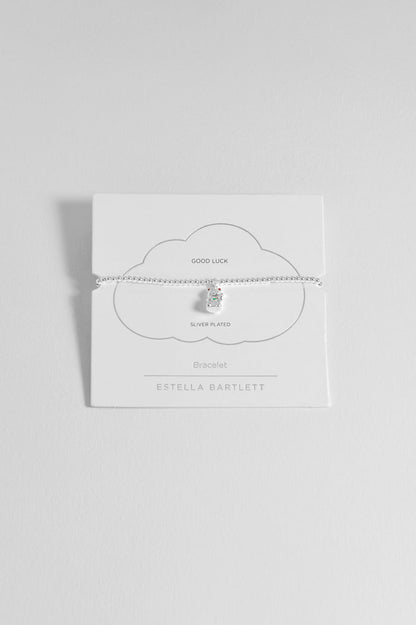 Silver necklace on a white card with 'Estella Bartlett' branding against a light gray background