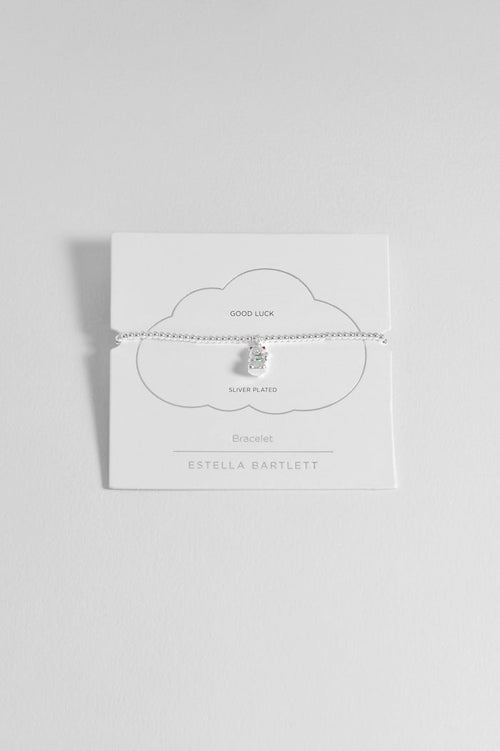 Silver necklace on a white card with 'Estella Bartlett' branding against a light gray background