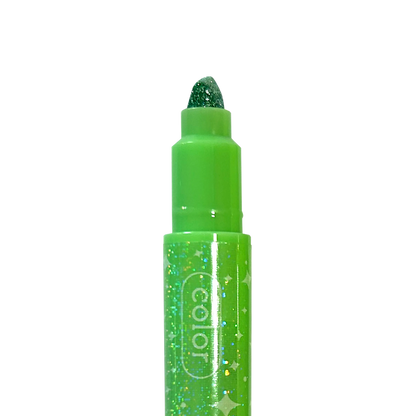 Close up of tip of green OOLY Make No Mistake! Glittery Erasable Markers on a white background