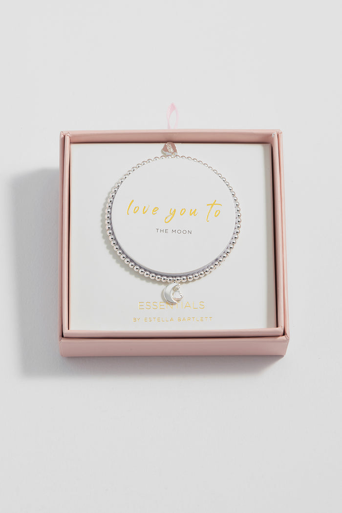 Silver bracelet with 'love you to the moon' text in a pink box on a light gray background