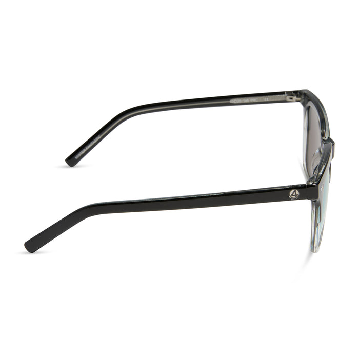 diff eyewear x fantastic four featuring the mr. fantastic square sunglasses with a black to clear frame and quantum blue mirror polarized lenses side view