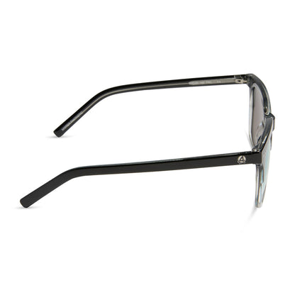 diff eyewear x fantastic four featuring the mr. fantastic square sunglasses with a black to clear frame and quantum blue mirror polarized lenses side view