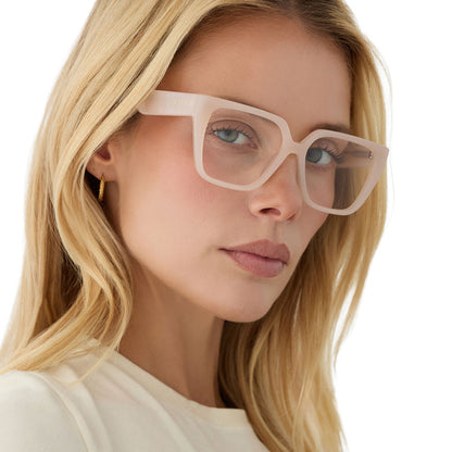 on model - female wearing diff eyewear featuring the olive square prescription glasses with a milky blush acetate frame angled view