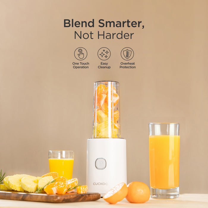 CUCKOO personal blender featuring one-touch operation, easy cleanup, and overheat protection, with fruit and juice nearby. (CFM-D60W)