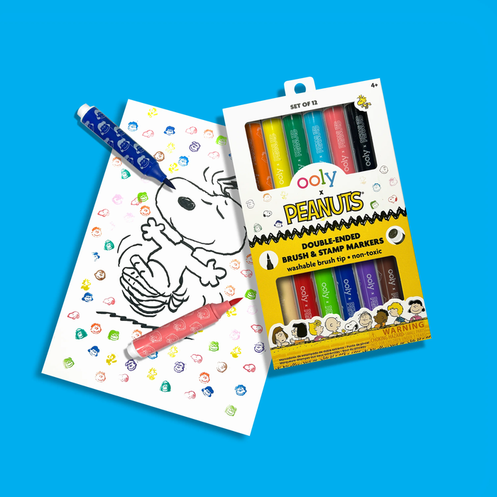 Set of OOLY x Peanuts Double-Ended Brush & Stamp Markers and drawing of Snoopy with stamps