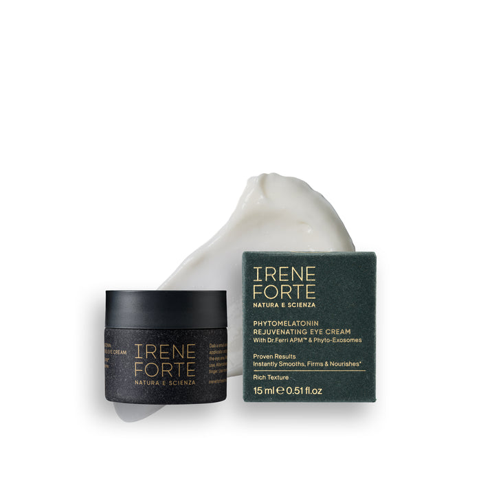 Irene Forte Skincare Phytomelatonin Rejuvenating Eye Cream shown with its black jar, dark green box, and a white eye-shaped cream dollop on a clean white background.