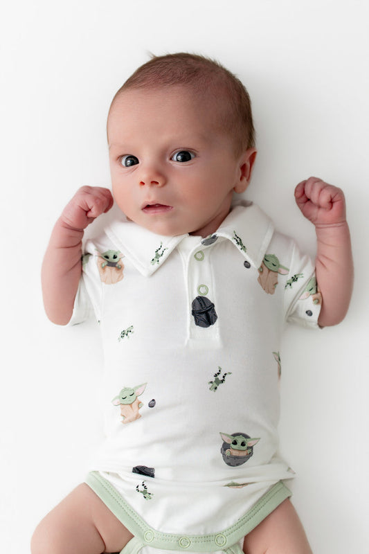 Close up of newborn wearing the Polo Bodysuit in Grogu™