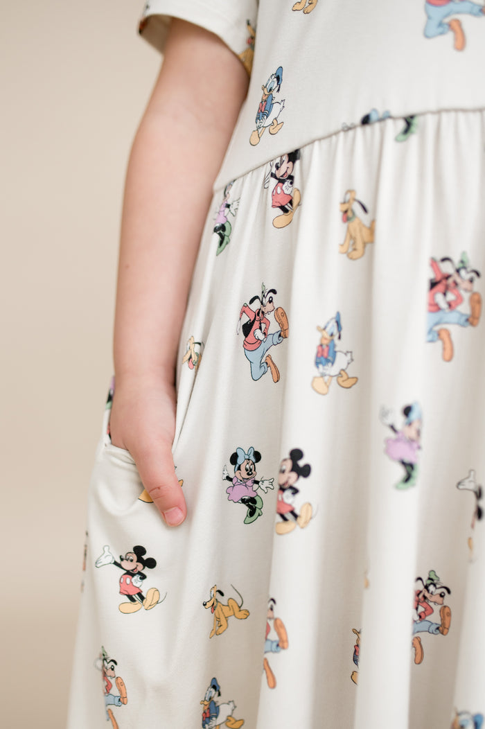 Close up of pocket detail on mickey mouse and friends toddler polo dresss