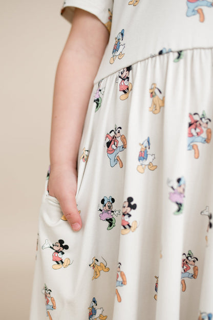 Close up of pocket detail on mickey mouse and friends toddler polo dresss