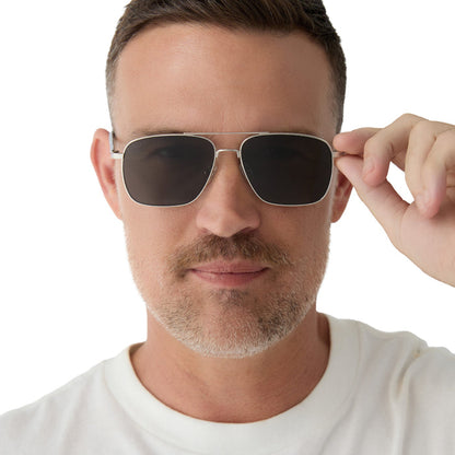 on model - male wearing yellowstone x diff eyewear featuring the rip wheeler navigator sunglasses with a silver frame and grey polarized lenses front view