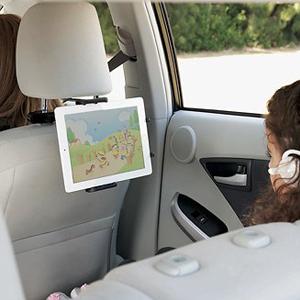 ipad white mounted on headrest of vehicle
