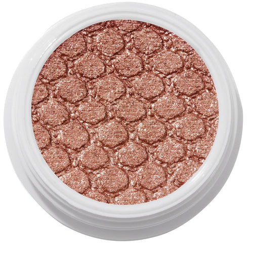 ColourPop Sequin Super Shock Shadow shimmers in metallic copper rose-gold as it catches light, pressed with a scale-embossed texture in a white round pot, shown in a clean studio overhead close-up.