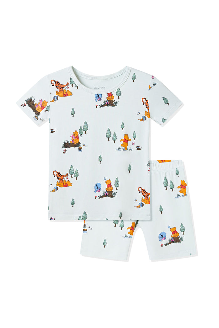 Short Sleeve Pajamas in Winnie the Pooh Hundred Acre Wood print on a white background