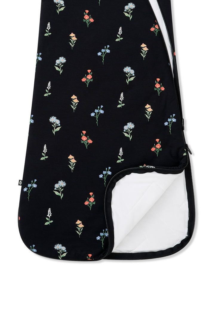 Black Sleep Bag with Wildflower 1.0 print with dual zipper on a white background