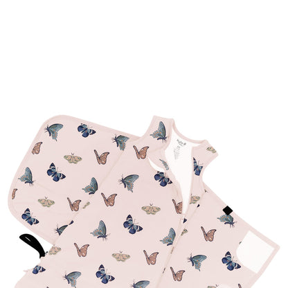 Sleep Bag Swaddler in Blush Butterfly 1.0 shown unswaddled and top zipper unzipped