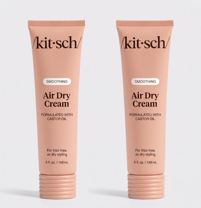 Two tubes of Kitsch Smoothing Air Dry Cream formulated with castor oil, 5 fl. oz. (148 mL), displayed side by side on a white background for frizz-free, air-dry styling.