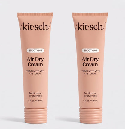 Two tubes of Kitsch Smoothing Air Dry Cream formulated with castor oil, 5 fl. oz. (148 mL), displayed side by side on a white background for frizz-free, air-dry styling.