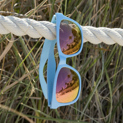 lifestyle - still life of diff sport storm baby blue sunglasses hanging around outdoors