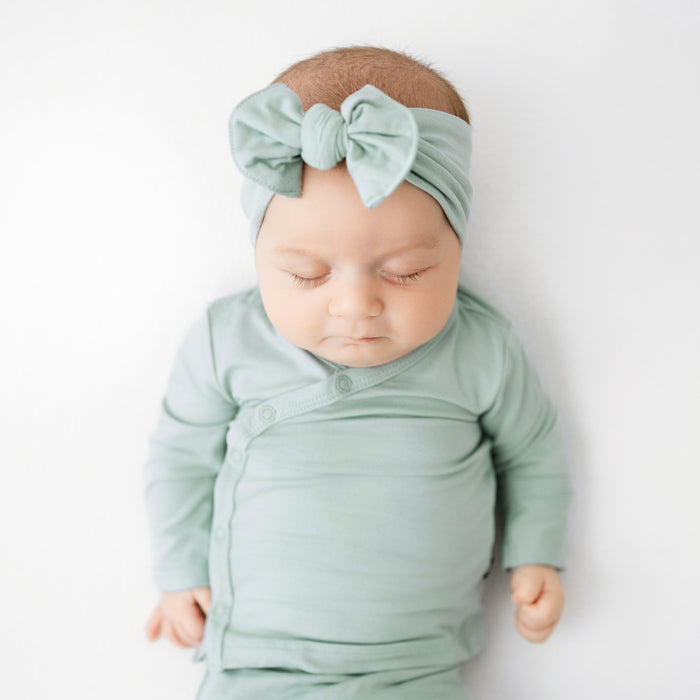 Baby sleeping in Bamboo Take Me Home Hospital Set with Bow in Sage