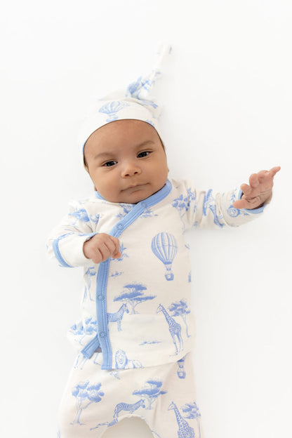 Close up of newborn wearing the Take Me Home Set with Cap in Toile Safari