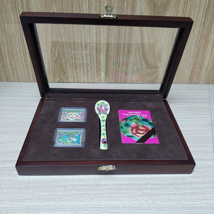 The Singapore Mint Peranakan collection stamp and spoon