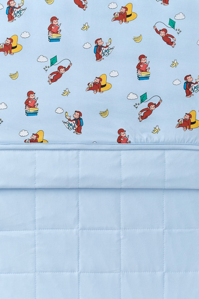 Front and back of Blue Toddler Blanket in Curious George 1.0 print
