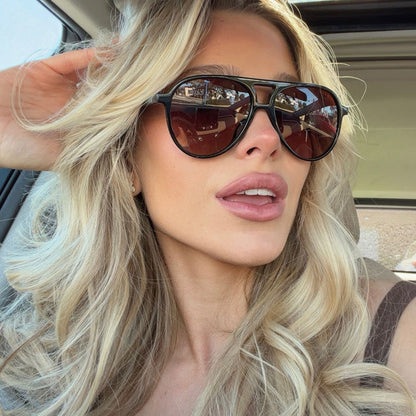 shelby hunstad blonde influencer in car wearing tosca ii aviators