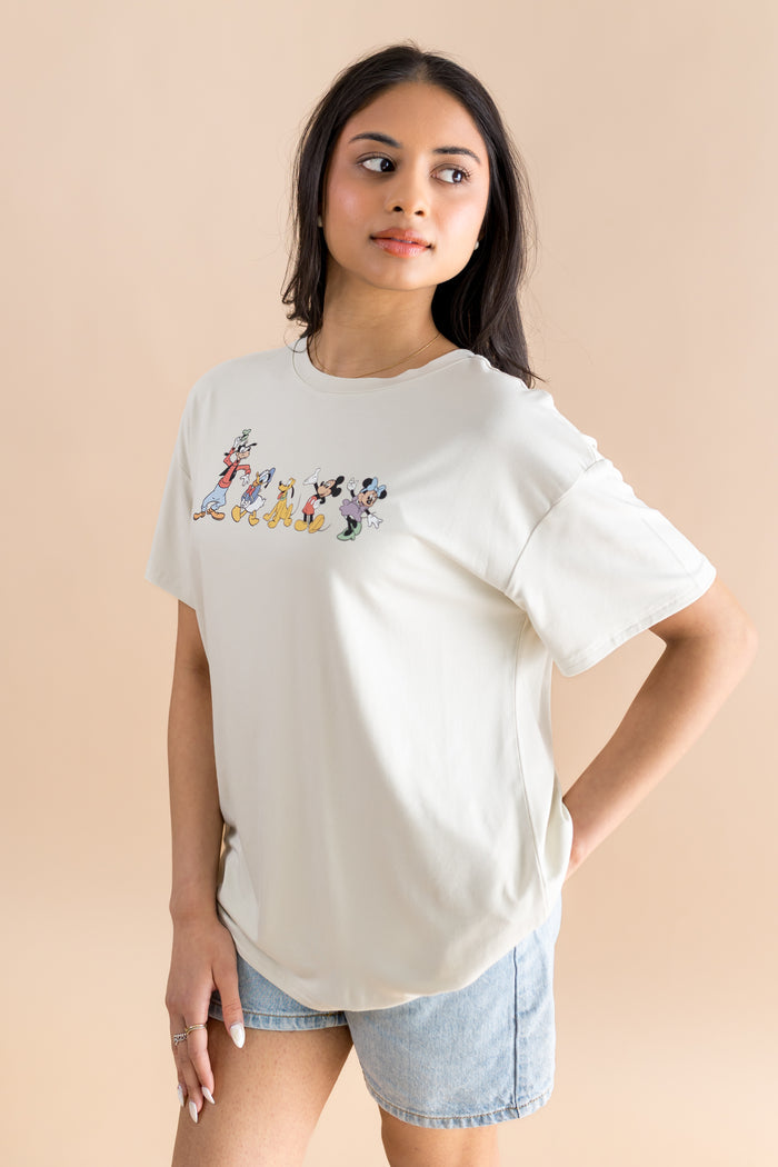 Woman modeling graphic tee with mickey and friends