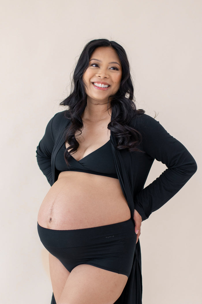 Smiling pregnant women posing wearing the Women's High-Waisted Brief in Midnight and matching bralette and robe
