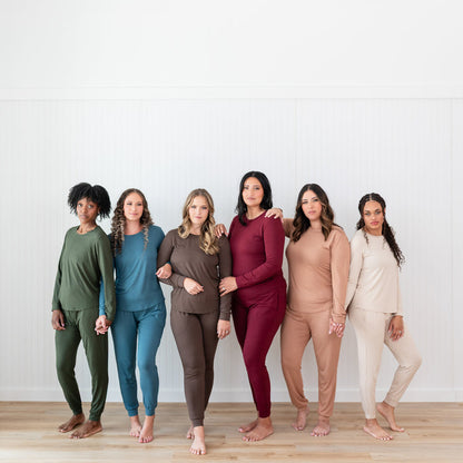 Six women standing side by side wearing the Women's Jogger Pajama Set in the six fall colors