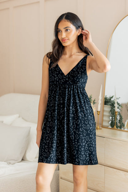 Model posing in Women's Nightgown in Midnight Leopard print standing in front of a dressing mirror.