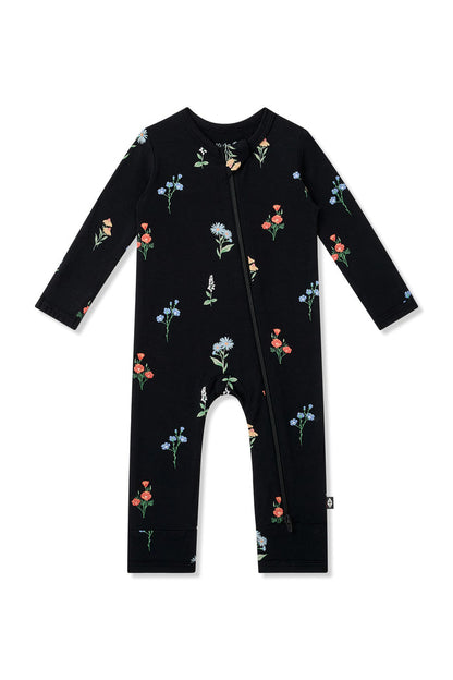 Black Zippered Romper in Wildflower print on a white background